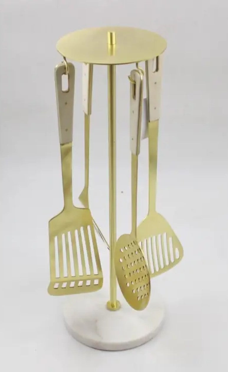 Set of 4 Gold Serving Utensils with Marble Handles on Marble Base